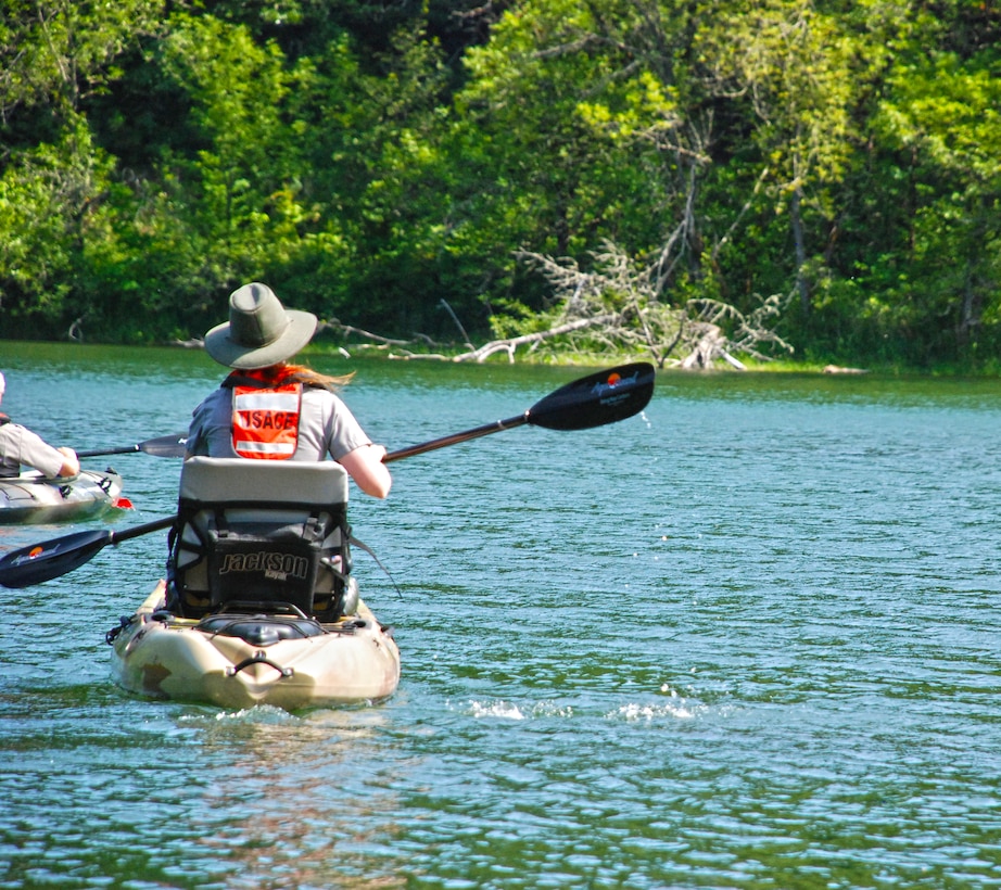 Ranger Jesse Brownlee is one of two Natural Resource Specialists kayaking on Bass Lake near Bonneville Lock and Dam, searching for the Western Painted turtle, a species native to this area. She is accompanied by Skip Fowler, a supervisory park ranger, who is also involved in this important environmental stewardship effort. By working together, Jesse and Skip are following one of the key principles of water safety: don't go out on the water alone. Even when the water is calm and the weather is clear, being out with someone else is safer--and in this case, can also get the work done more quickly.