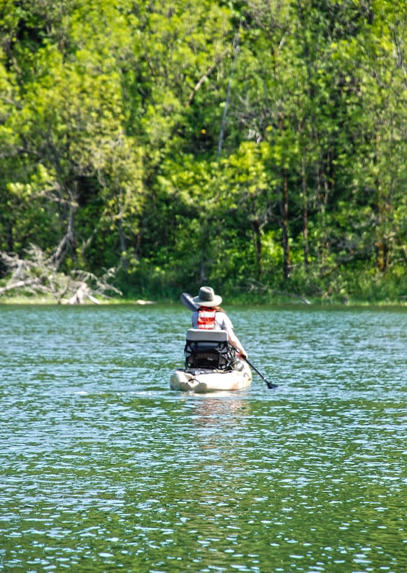 Ranger Jesse Brownlee is one of two Natural Resource Specialists kayaking on Bass Lake near Bonneville Lock and Dam, searching for the Western Painted turtle, a species native to this area.