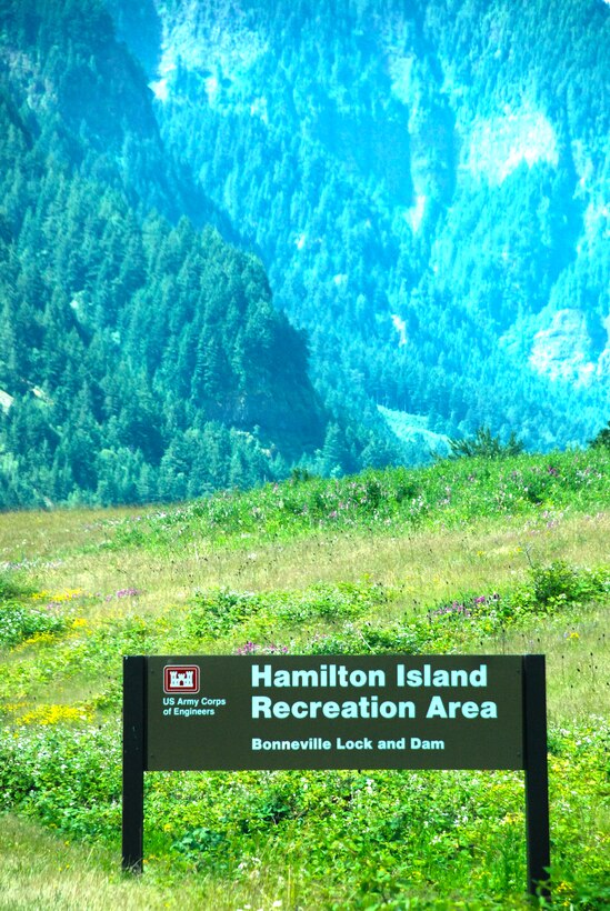 The sign for the Hamilton Island Recreation Area overlooks an excellent scenic view of the landscape.