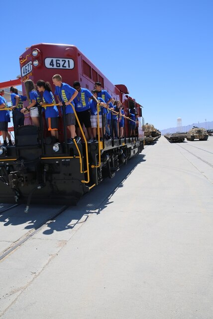 Adolescents from the Barstow Community College Summer Youth Program tour Marine Corps Logistics Base Barstow, Calif., June 19. During their tour, they visited with the Marine Corps Police Department’s K-9 unit here, the base gym, and the rail yard where they learned about different military vehicles and equipment.