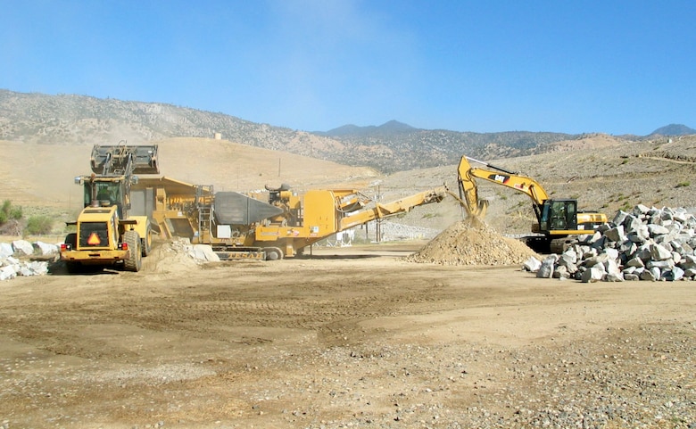 Contractors with the Sacramento District crush stones June 16, 2014 near Isabella Lake, Calif., as part of ongoing materials testing to determine the suitability of stone for use in the construction of the Isabella Lake Dam Safety Modification Project. Work is scheduled to continue through August.