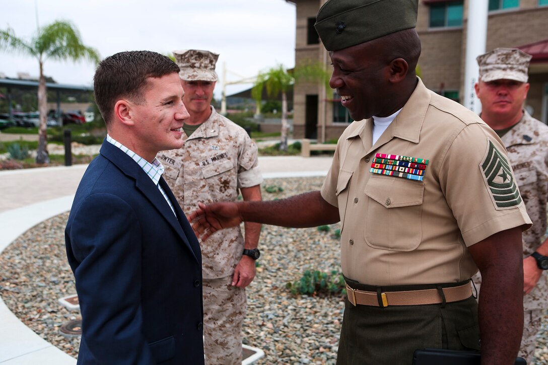 Sgt. Maj. Ronald L. Green, the I Marine Expeditionary Force’s sergeant major, greets Medal of Honor recipient Cpl. William “Kyle” Carpenter aboard Marine Corps Base Camp Pendleton, Calif., June 23, 2014. During the visit, Carpenter visited Wounded Warrior Battalion West and spoke to service members at the base theater. Carpenter earned the nation’s highest military award for his actions in Helmand province, Afghanistan, in November 2010. He saved another Marine’s life by shielding him from a grenade blast during an enemy attack. 