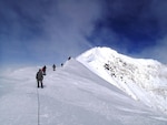 JOINT BASE ELMENDORF-RICHARDSON, Alaska (June 24, 2014) - The 4th Infantry Brigade Combat Team (Airborne), 25th Infantry Division, climb team, sponsored by U.S. Army Alaska, makes its way across Summit Ridge on Mount McKinley, June 15, 2014, at the Denali National Park and Preserve, Alaska. The team was there to demonstrate their arctic abilities and validate both their training and their equipment.  