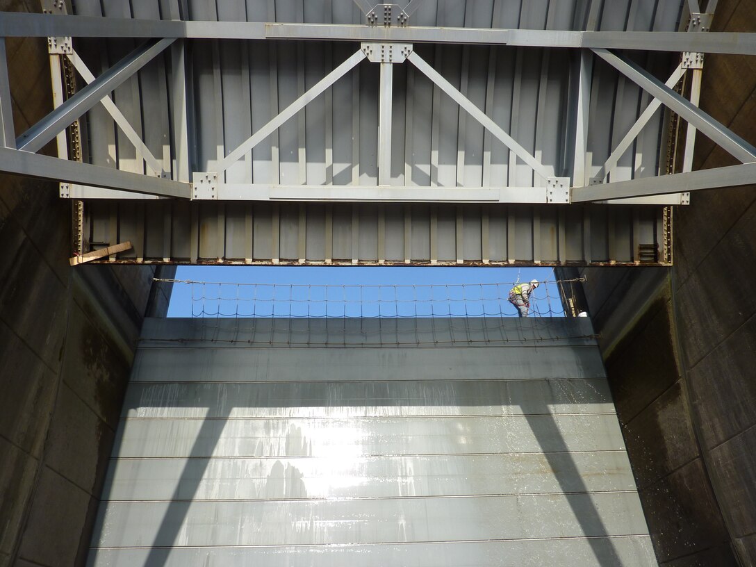 Spillway Gate Rehabilitation Project at Gavins Point Dam near Yankton, S.D. Gate 11 open to 28 feet during a function check. Stoplogs are in place preventing water from flowing through while the gate is open.