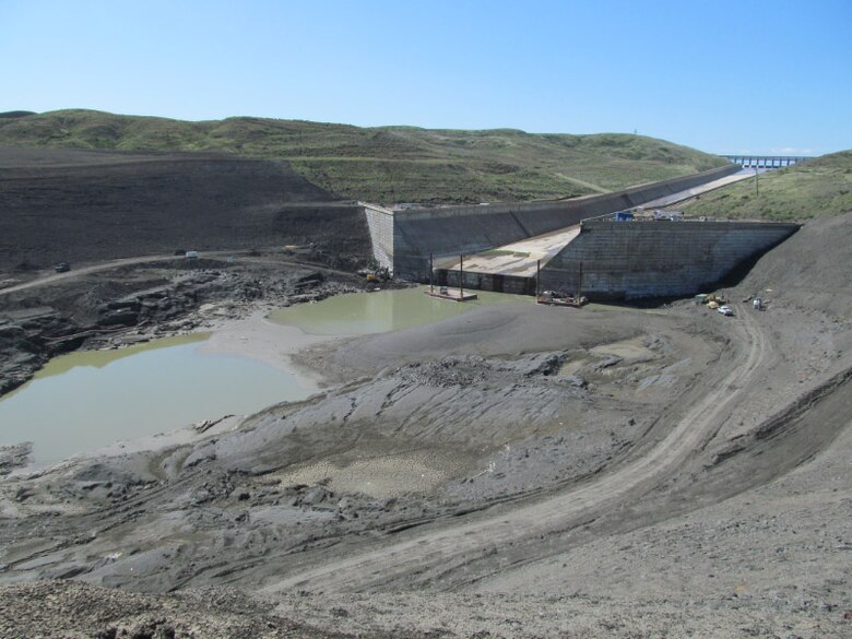 Contractors are working on the plunge pool at Fort Peck Dam installing horizontal anchors in the downstream concrete wall.