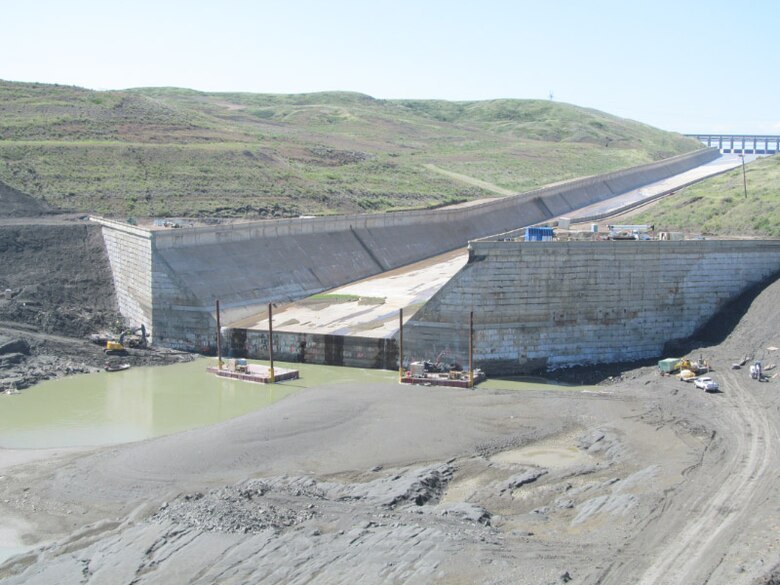 Bottom of the Fort Peck spillway. Contractors are working on the plunge pool at the end of the spillway installing horizontal anchors in the downstream concrete wall.