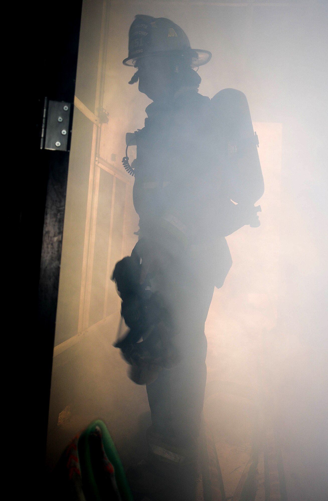 Spc. Adam North looks for casualties during simulated search and rescue training as part of the 2014 Golden Coyote exercise June 11, 2014, on Ellsworth Air Force Base, S.D. The U.S. military reserve components and international forces routinely conduct joint training in support of overseas contingency operations and homeland defense. North is a South Dakota Army National Guard 451st Engineering Detachment Firefighting Team specialist. (U.S. Air Force photo/Senior Airman Zachary Hada)