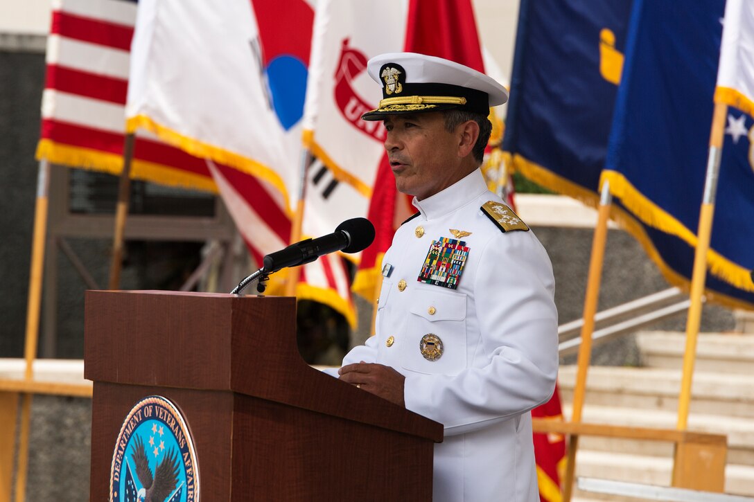 Navy Adm. Harry Harris Jr., U.S. Pacific Fleet commander, recognizes the significance of the Korean War during the 64th annual Korean War memorial ceremony at the National Memorial Cemetery of the Pacific (Punchbowl), June 25, 2014. The ceremony commemorated U.S. and Republic of Korea veterans, both living and dead, who fought for the freedom of South Korea, and guests in attendance laid wreaths at the base of the memorial to honor those who gave their lives. (U.S. Marine Corps photo by Cpl. Matthew J. Bragg)
