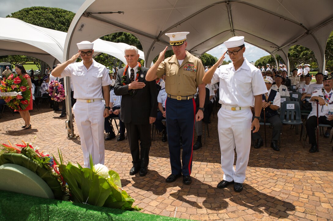 Col. Jeffrey J. Davis (second from right), chief of staff, salutes the wreaths laid at the base of the National Memorial Cemetery of the Pacific (Punchbowl) during the 64th annual Korean War memorial ceremony, June 25, 2014. The ceremony commemorated U.S. and Republic of Korea veterans, both living and dead, who fought for the freedom of South Korea, and guests in attendance laid wreaths at the base of the memorial to honor those who gave their lives. (U.S. Marine Corps photo by Cpl. Matthew J. Bragg)