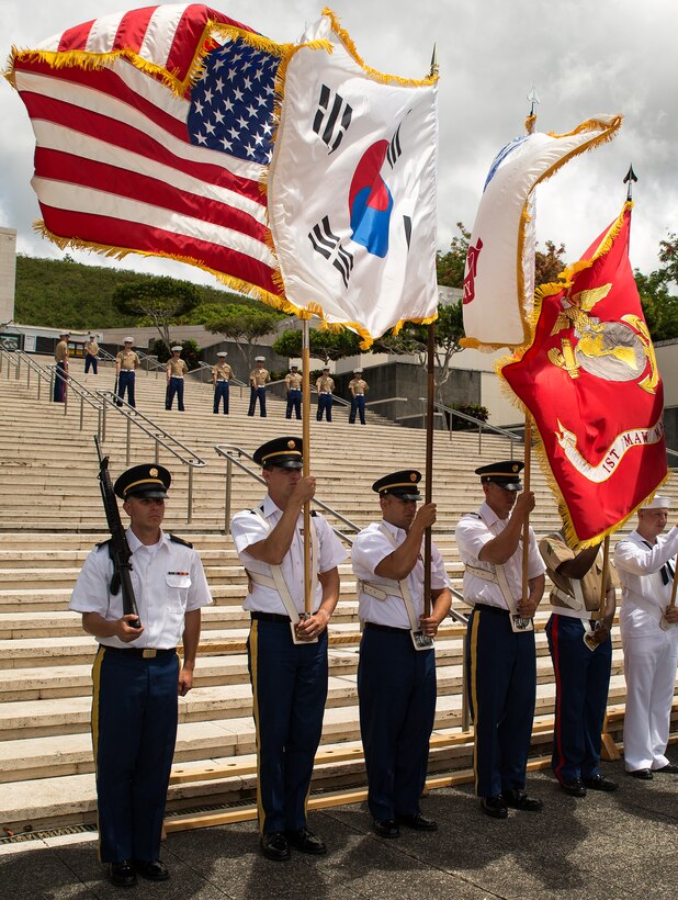 A U.S. joint service color guard presents during the 64th annual Korean War memorial ceremony at the National Memorial Cemetery of the Pacific (Punchbowl), June 25, 2014. The ceremony commemorated U.S. and ROK veterans, both living and dead, who fought for the freedom of South Korea, and guests in attendance laid wreaths at the base of the memorial to honor those who gave their lives. (U.S. Marine Corps photo by Cpl. Matthew J. Bragg)