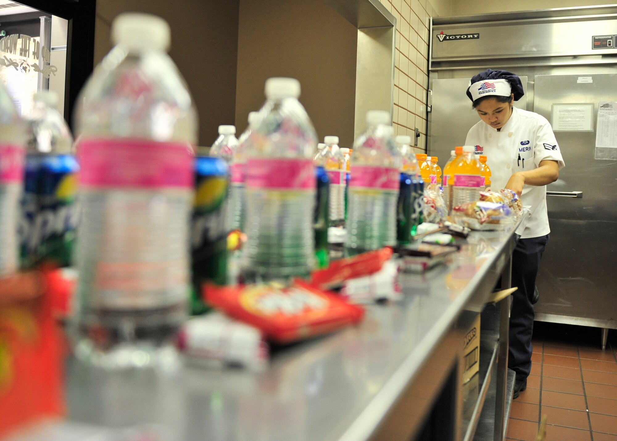 U.S. Air Force Airman 1st Class Alexis Merin, 354th Force Support Squadron shift worker documents flight meals for different units to pick up at the Two Seasons Dining Facility during RED Flag-Alaska 14-2, June 23, 2014, Eielson Air Force Base, Alaska. Daily, Merin prepared a minimum of 350 flight meals for fliers and people working during the scheduled eating times. (U.S. Air Force photo by Senior Airman Ashley Nicole Taylor/Released)