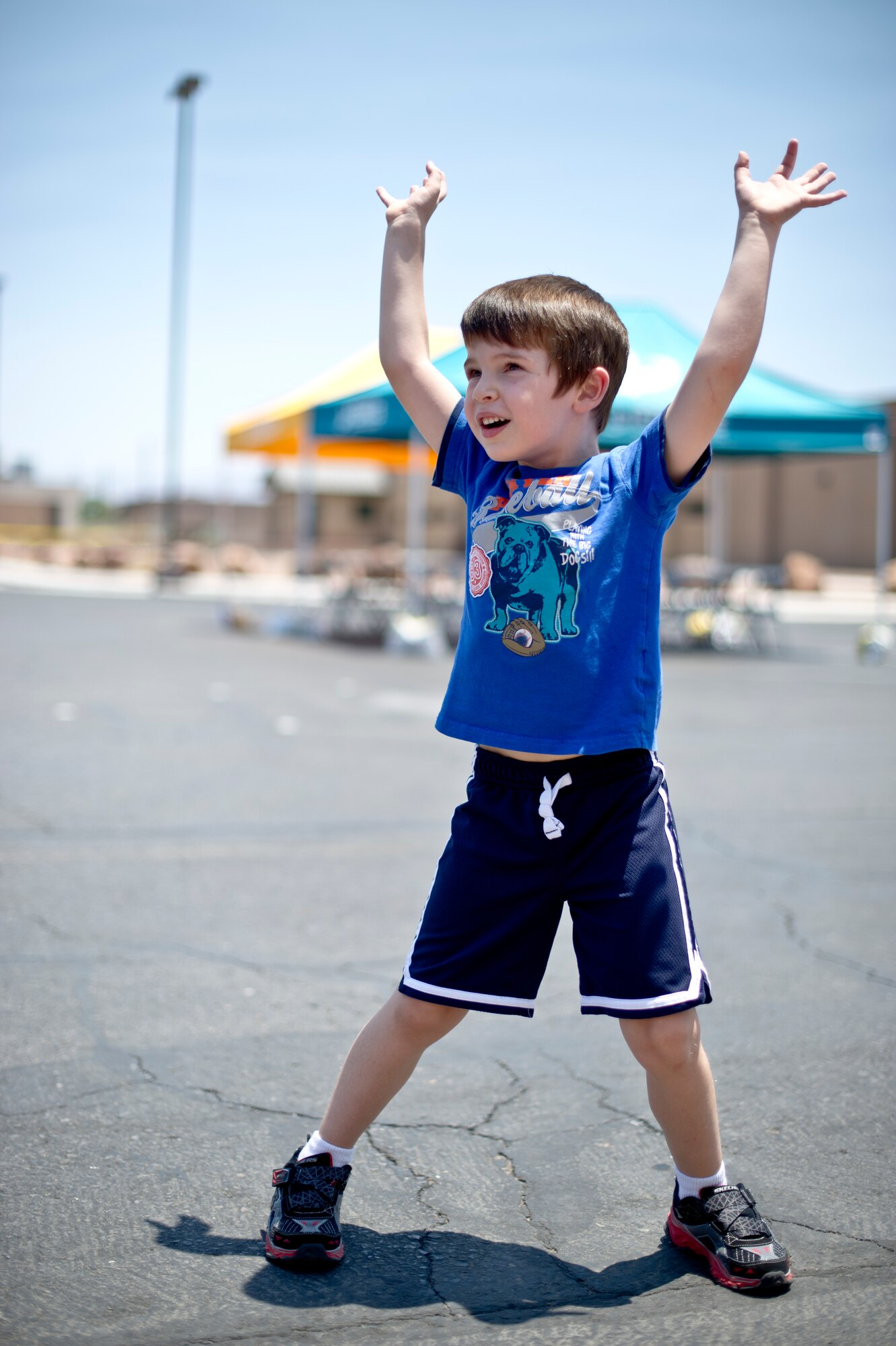 A child at Holloman Air Force Base N.M., dances during a commissary-hosted event to promote healthy living June 26, 2014. Events for the day included education and outreach to the community to improve healthy lifestyle habits, tips for physical fitness and well-being as well as games. (U.S. Air Force photo by Staff Sgt Stacy Moless/Released)