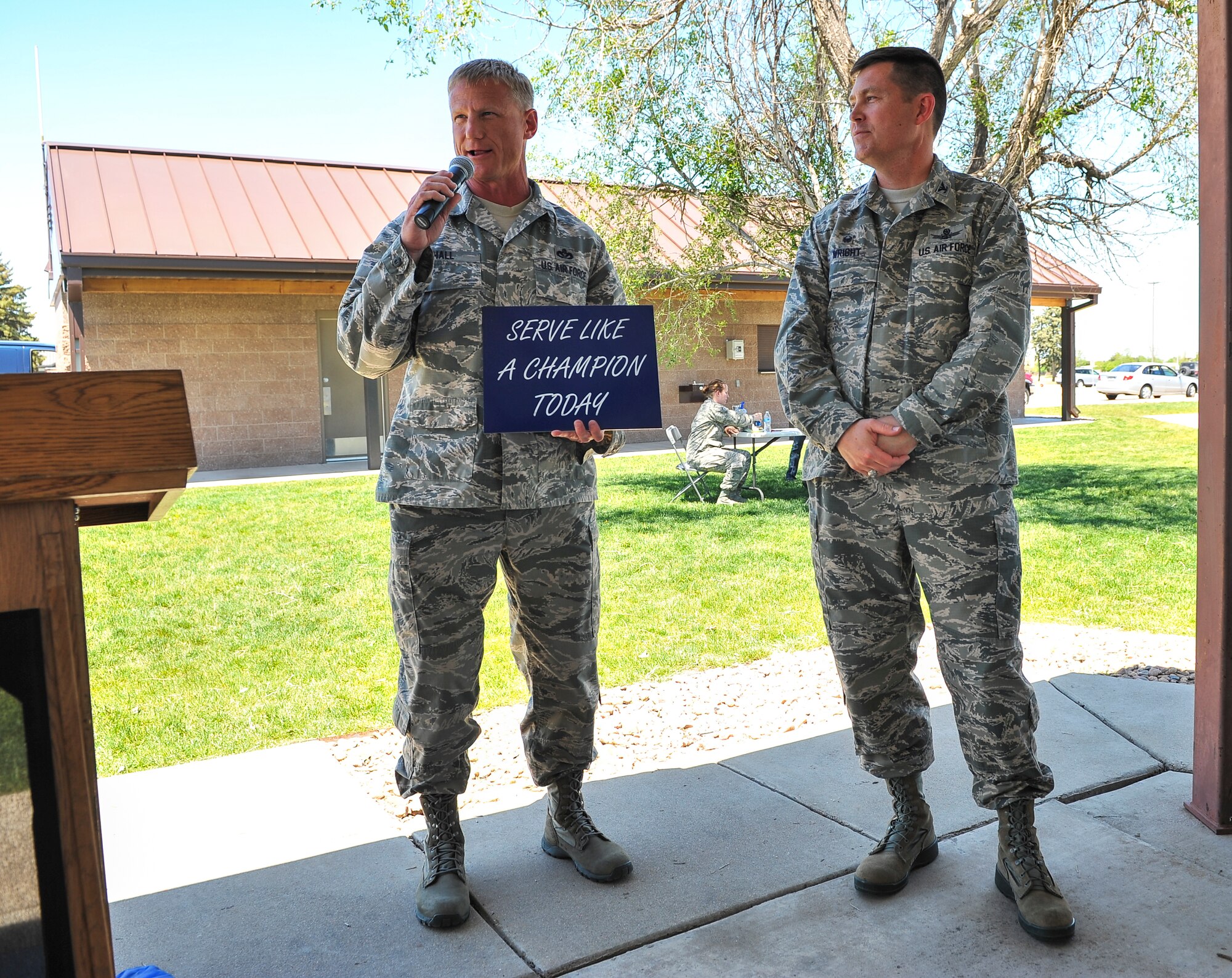 Col. Dan Wright, Aerospace Data Facility - Colorado commander, received the third "Serve Like A Champion" sign May 28, 2014, at Buckley Air Force Base, Colo. He demonstrated championship caliber servant leadership day in and day out, especially during the fiscal crisis and Team Buckley losses that the base faced during his command. (U.S. Air Force photo by Senior Airman Phillip Houk/Released) 
