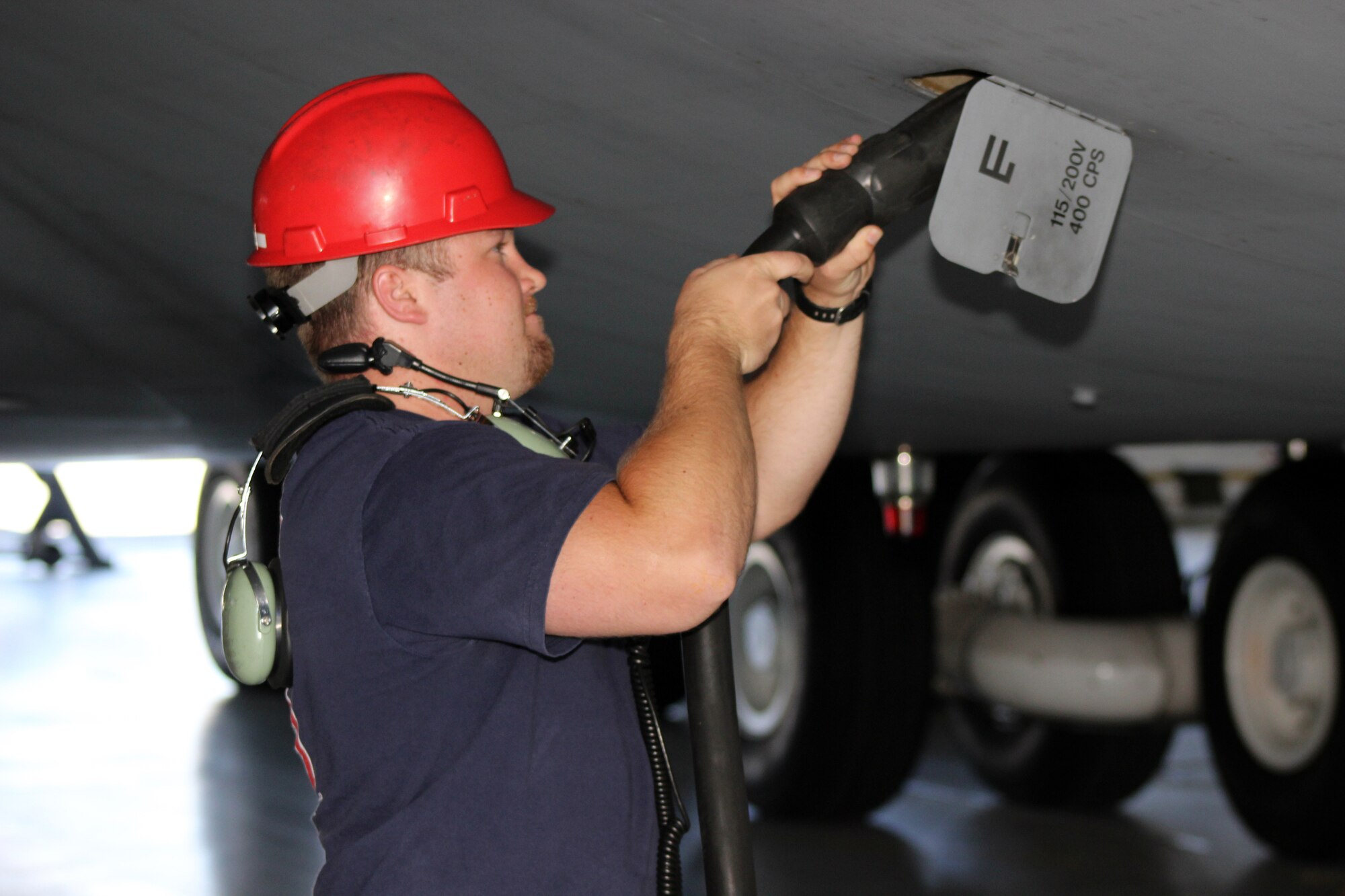 Tech. Sgt. Robert Rossey, 512th Aircraft Maintenance Squadron crew chief and air reserve technician, attaches an auxiliary power unit to the C-5M Super Galaxy aircraft at Dover Air Force Base, Del., June 20, 2014. The 512th Airlift Wing currently has vacancies for the crew chief career field. Interested applicants can contact an Air Force Reserve recruiter. (U.S. Air Force photo/Herbert E. Welday III)