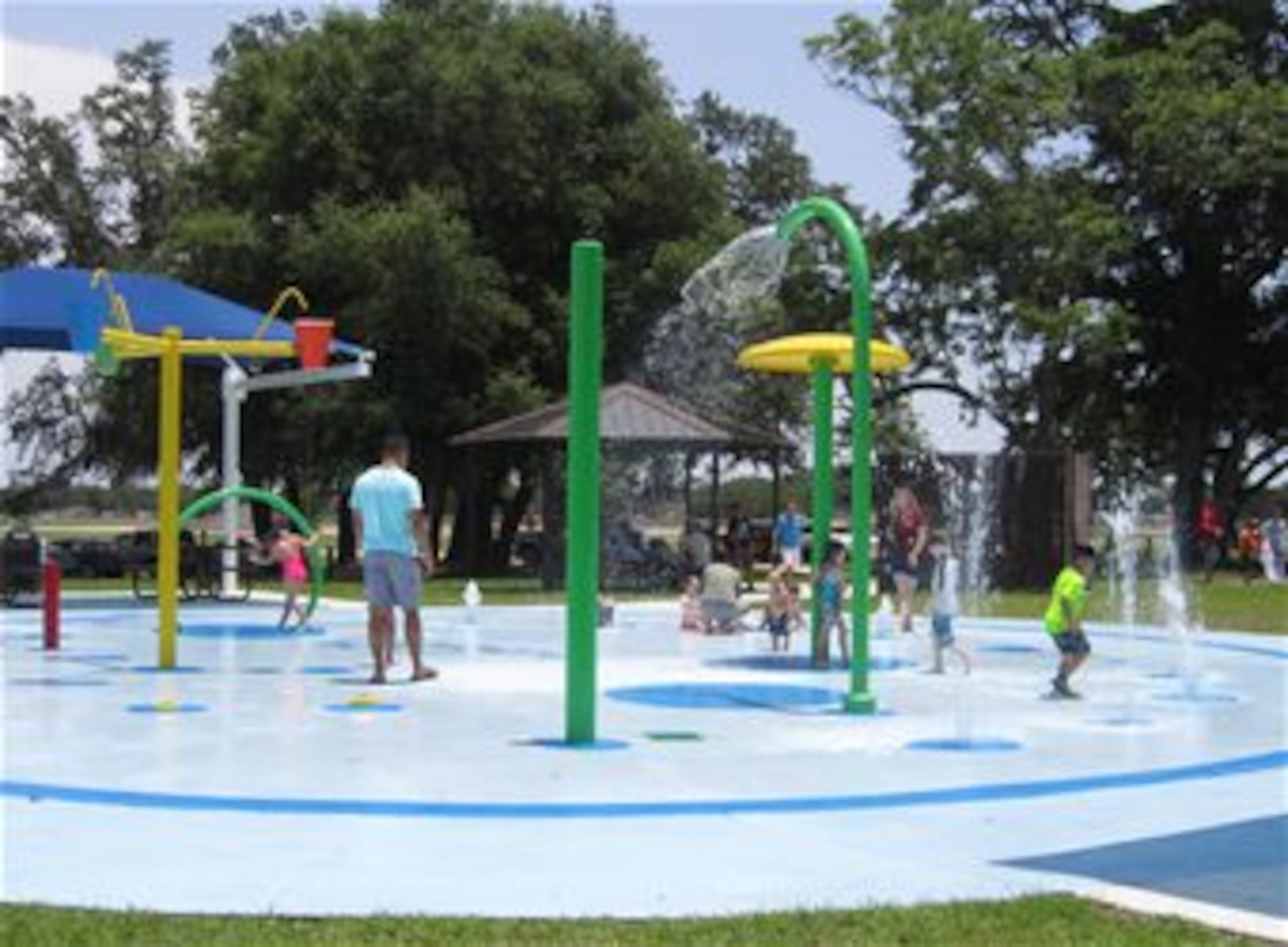 Keesler children play at the Splash Pad at the Marina, June 18. The splash pad is an eco-friendly addition, as it is a fresh water system that utilizes water from Keesler’s water supply and drains into the Bay Breeze Golf Course reservoir where it is then used for irrigating the golf course. (Courtesy photo by Lisa Campbell)