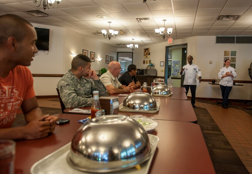 Competitors listen as U.S. Air Force Senior Airman Arthur Williams, 23d Force Support Squadron food services specialist, gives instructions before the start of a Man vs. Food competition at Moody Air Force Base, Ga., June 25, 2014. Williams got the idea to organize the competition after seeing the show on television and realizing he’d never seen a similar event on any base. (U.S. Air Force photo by Senior Airman Jarrod Grammel/Released)
