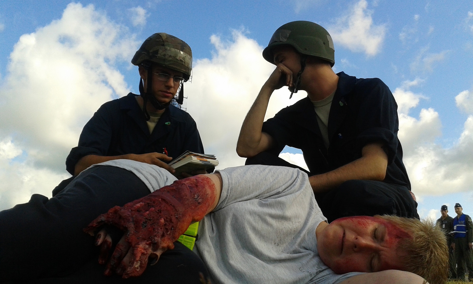 Airmen assess a simulated victim with multiple injuries during the 48th Fighter Wing’s mission assurance exercise at Royal Air Force Lakenheath, England, June 25, 2014. The three-day training event was designed to better prepare Airmen to respond to real-world crises and emergencies while also highlighting the importance of vigilance and safety. (U.S. Air Force photo by Tech. Sgt. Eric Burks/Released)