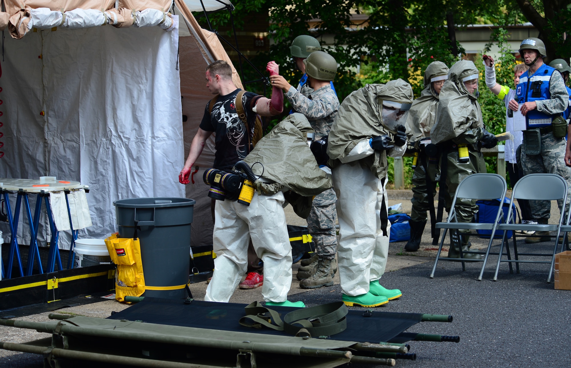 Airmen from the 48th Medical Group practice in-place patient decontamination capability during the 48th Fighter Wing’s mission assurance exercise at Royal Air Force Lakenheath, England, June 25, 2014. The exercise was designed to better prepare Airmen to respond to real-world crises and emergencies while also highlighting the importance of vigilance and safety. (U.S. Air Force photo by Airman 1st Class Dana J. Butler/Released)