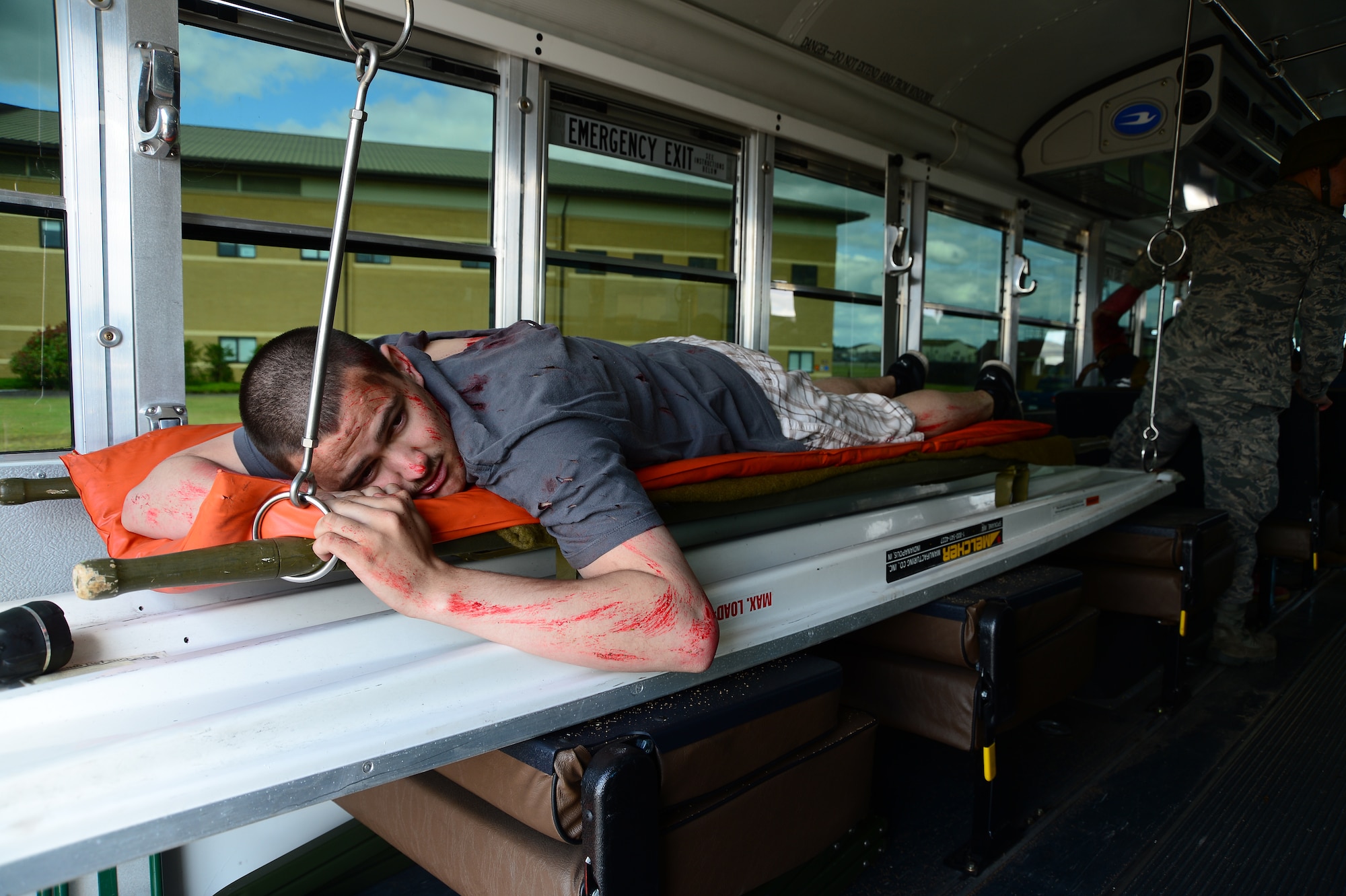 A simulated victim is transported on a medical bus during the 48th Fighter Wing’s mission assurance exercise at Royal Air Force Lakenheath, England, June 25, 2014. The exercise was designed to better prepare Airmen to respond to real-world crises and emergencies while also highlighting the importance of vigilance and safety. (U.S. Air Force photo by Airman 1st Class Dana J. Butler/Released)