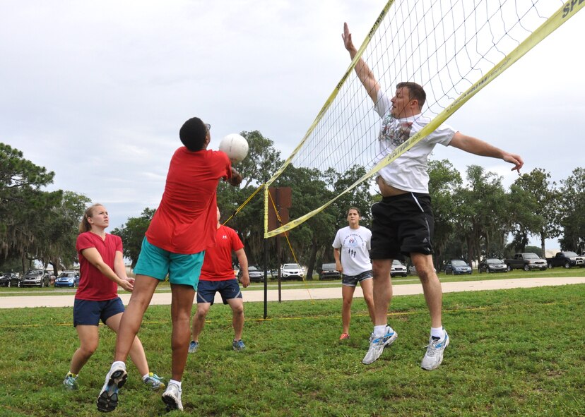 Airmen from the Armament Directorate participate in volleyball during their unit's quarterly field day morale event June 26 at Eglin Air Force Base, Fla. The directorate, a tenant unit here, is charged with enhancing worldwide Air Force combat capability and effectiveness through joint development, test, procurement, deployment and product sustainment support for air delivered weapon systems. (U.S. Air Force Photo/Ilka Cole)