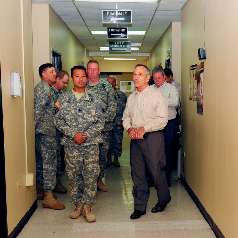U. S. Army Lt. Col. Huy Luu (left), Medical Element commander, gives a tour of the Medical Element to Mr. Alan Bersin, Department of Homeland Security Assistant Secretary of International Affairs and Chief Diplomatic Officer, along with U. S. Army Col. Kirk Dorr, JTF-Bravo commander. Mr. Bersin visited Joint Task Force-Bravo June 25, 2014, where he received a missions and capabilities brief and toured the Medical Element and other Soto Cano Air Base facilities. (Photo by Martin Chahin) 