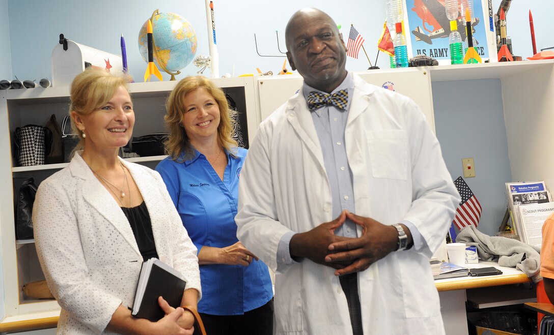 Athena Cody, spouse of Chief Master Sgt. of the Air Force James Cody (left), observes classroom activities with Melissa Spalding, Museum of Aviation education director, and Wesley Fondal, Starbase Robins director, during a tour of the museum June 25. On the tour, Mrs. Cody received an up-close view of the support the museum provides to youth education and to the Science, Technology, Engineering and Mathematics, (STEM), Program. (U.S. Air Force photo by Tommie Horton)