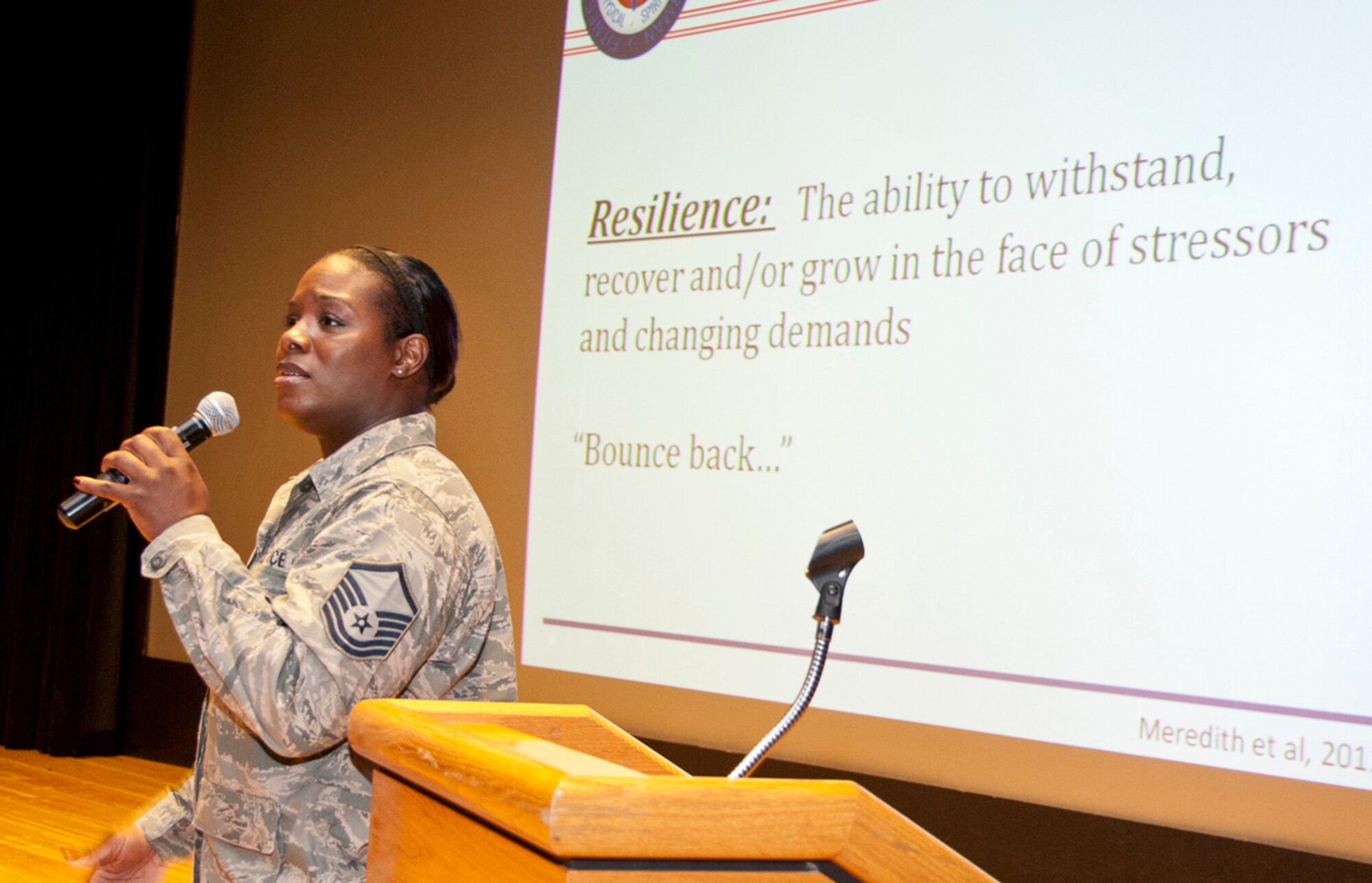 Master Sgt. Deana Miller, 673d Security Forces Squadron noncommissioned officer-in-charge of base access, speaks to 673d Air Base Wing Airmen during Resilient Airmen Day on Joint Base Elmendorf-Richardson, Alaska, June 20, 2014. When individuals have problems or stressors, which they withstand or grow from it is defined as being resilient. Miller briefed Airmen about the importance of being resilient. (U.S. Air Force photo/Airman 1st Class Tammie Ramsouer)