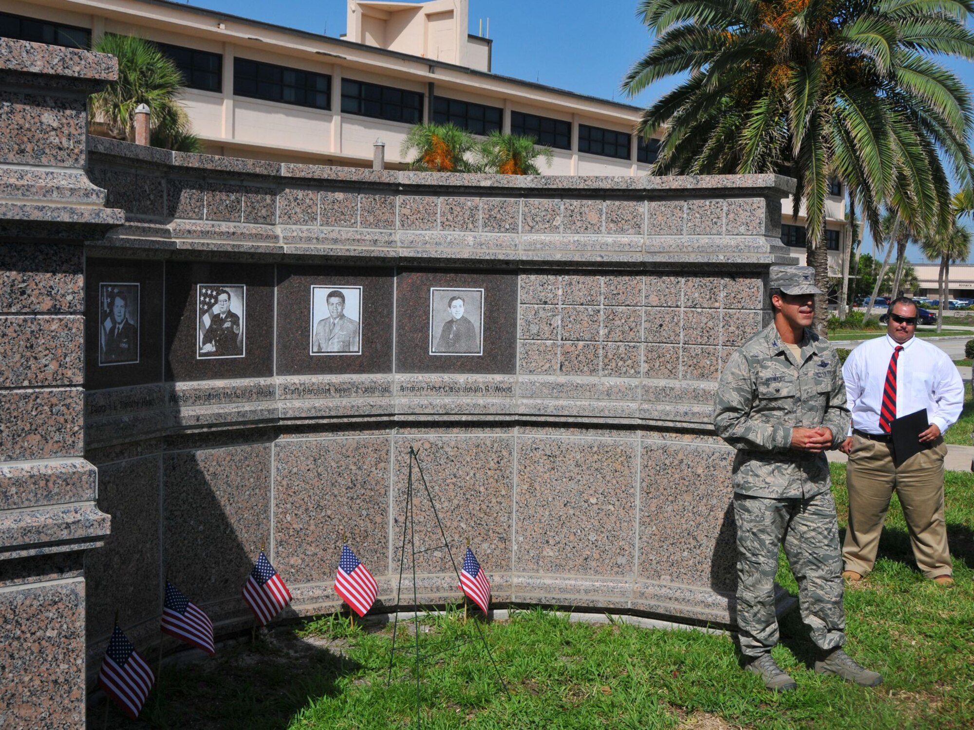 Col. Brett Howard, Vice Wing Commander of the 920th Rescue Wing, speaks at a ceremony held at Memorial Plaza here June 25 to commemorate the 18-year anniversary of a terrorist bombing that claimed the lives of 19 Airmen, including 5 from the rescue family. The bombing took place June 6, 1996 at Khobar Towers, a housing complex at Dhahran Air Base, Saudi Arabia, when a truck bomb exploded outside an 8-story building where Airmen were staying. In addition to the 19 Airmen, nearly 500 people of varied nationalities were wounded. (courtesy photo/Malcolm Denemark-Florida Today)