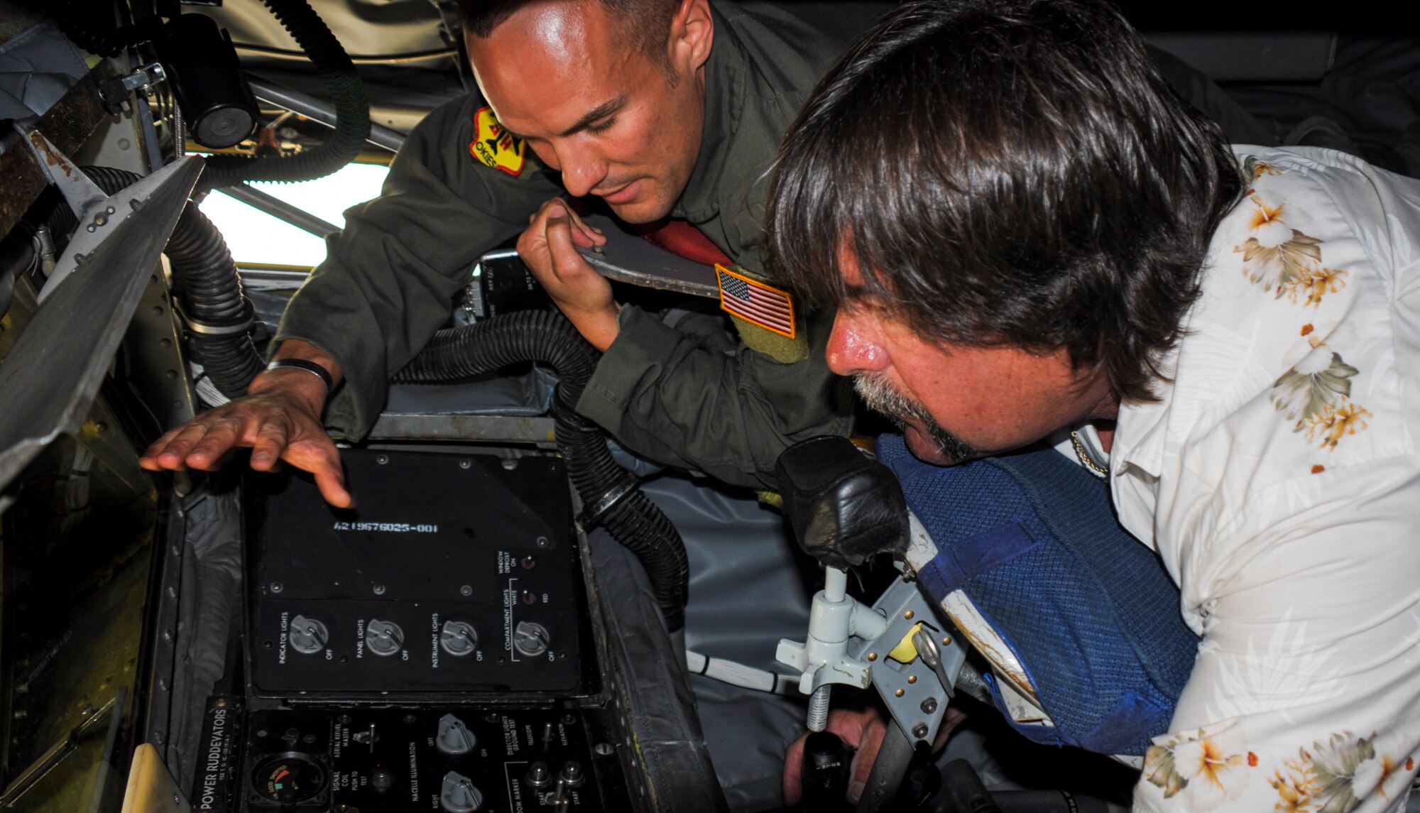 Tech. Sgt. Sean Gilson, 465th Air Refueling Squadron boom operator shows Mr. Phil Tinker how the refueling process works aboard a KC-135R Stratotanker June 23, 2014.  Tinker, the grandson of Maj. Gen. Clarence L. Tinker, flew in from his home in San Diego to attend the Star Spangled Salute June 21-22.  Maj. Gen. Tinker, an Oklahoma native, lost his life during World War II and, at the time was the highest ranking member of the U.S. Army to lose his life in combat.  On Oct. 14, 1942, the Oklahoma City Air Depot was renamed Tinker Field in honor Maj. Gen. Tinker.  Tinker AFB Star Spangled Salute open house marked the first time grandson, Phil has been to Oklahoma City since the bombing in 1995.  After the weekend’s activities, Tinker had an opportunity to tour the base as well as get a full tour of the 507th Air Refueling Wing’s KC-135.  (U.S. Air Force photo/Senior Airman Mark Hybers)