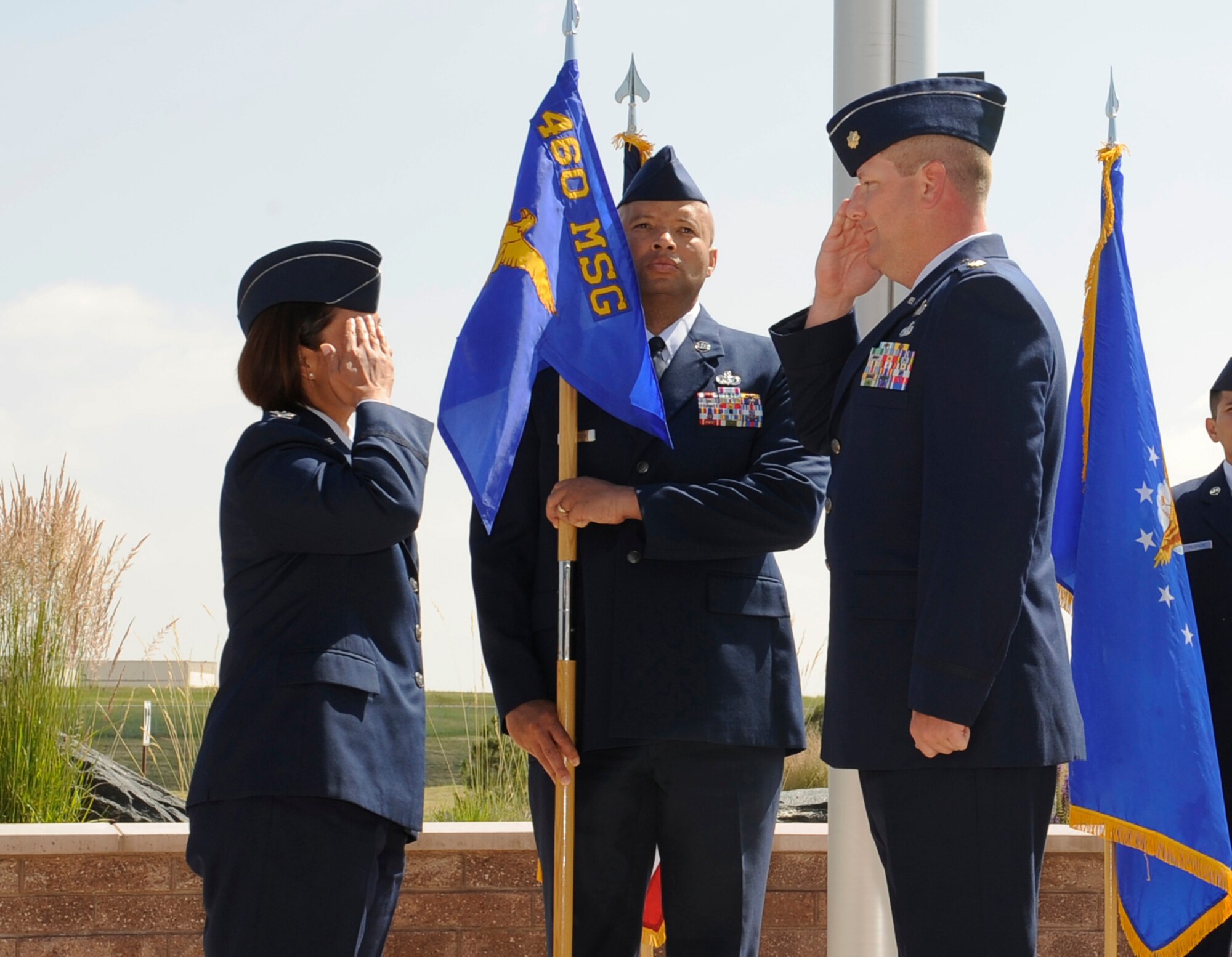 Maj. Jeremy Morrill, right, salutes Col. Rose Jourdan, left, 460th Mission Support Group commander, after relinquishing his command of the 460th Contracting Flight during the 460th CONF Change of Command Ceremony June 24, 2014, at the 460th Space Wing headquarters building on Buckley Air Force Base, Colo. Morrill served as the 460th CONF commander since July 2012, where he successfully led his flight through many challenges. (U.S. Air Force photo by Airman 1st Class Samantha
Saulsbury/Released)

