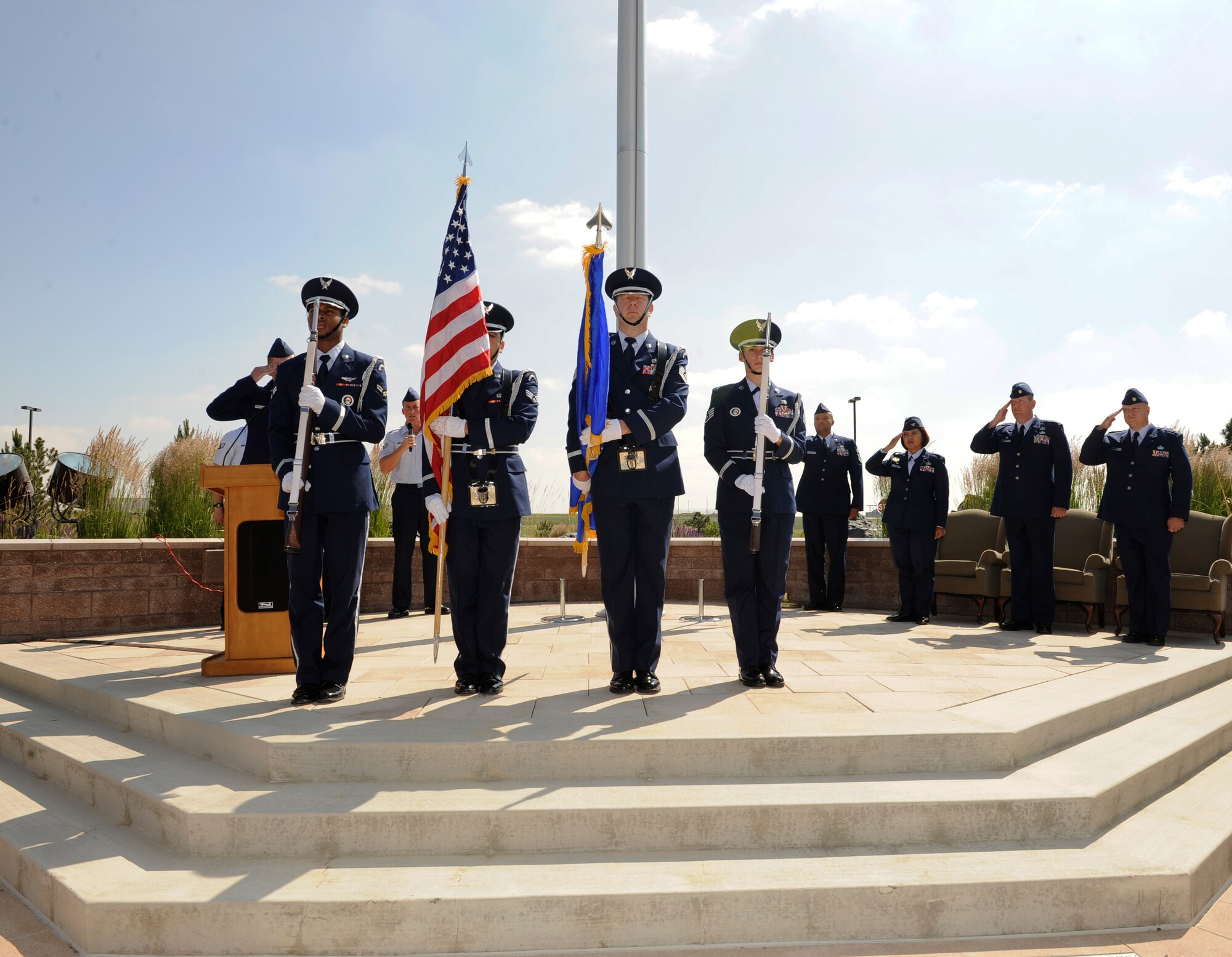 The Mile High Honor Guard presents the colors during the 460th Contracting Flight Change of Command Ceremony June 24, 2014, at the 460th Space Wing headquarters building on Buckley Air Force Base, Colo. The event signals Maj. Gene Smith's, 460th CONF commander, assumption of command from Maj. Jeremy Morrill. (U.S. Air Force photo by Airman 1st Class Samantha Saulsbury/Released)
