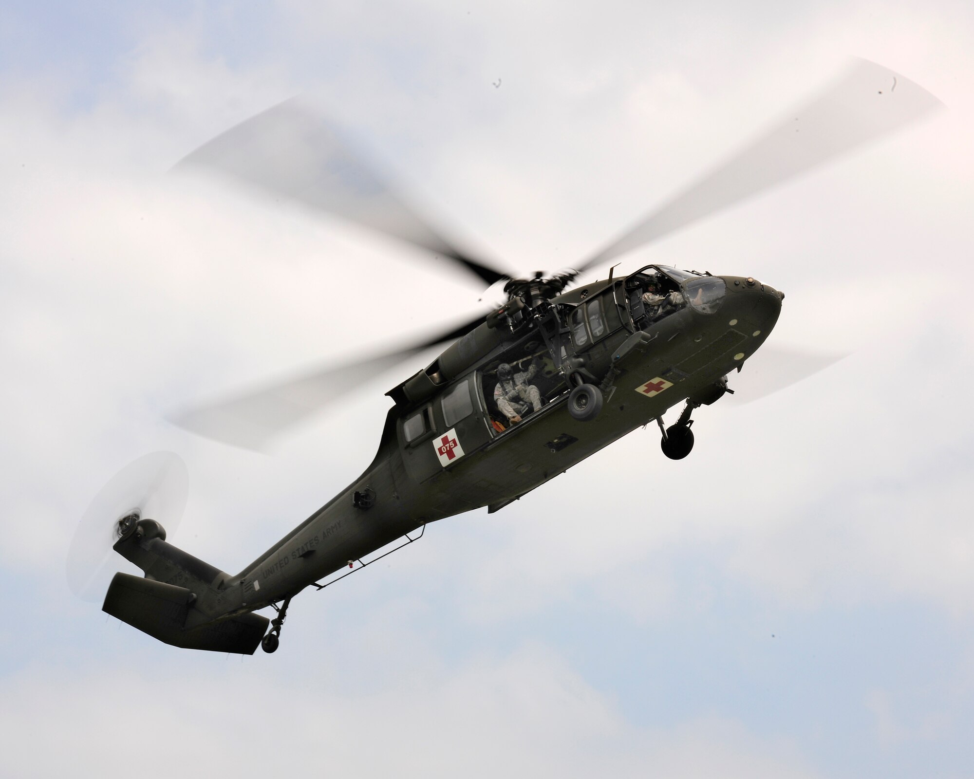 A U.S. Army UH-60 Black Hawk helicopter approaches the landing zone during a combat search and rescue training mission, June 24, 2014, at Cellina Meduna training ground near Maniago, Italy. Establishing a good relationship with other branches of the U.S. military helps mitigate risk and confusion in the event of a real-life situation requiring military intervention and assistance. (U.S. Air Force photo/Airman 1st Class Ryan Conroy) 