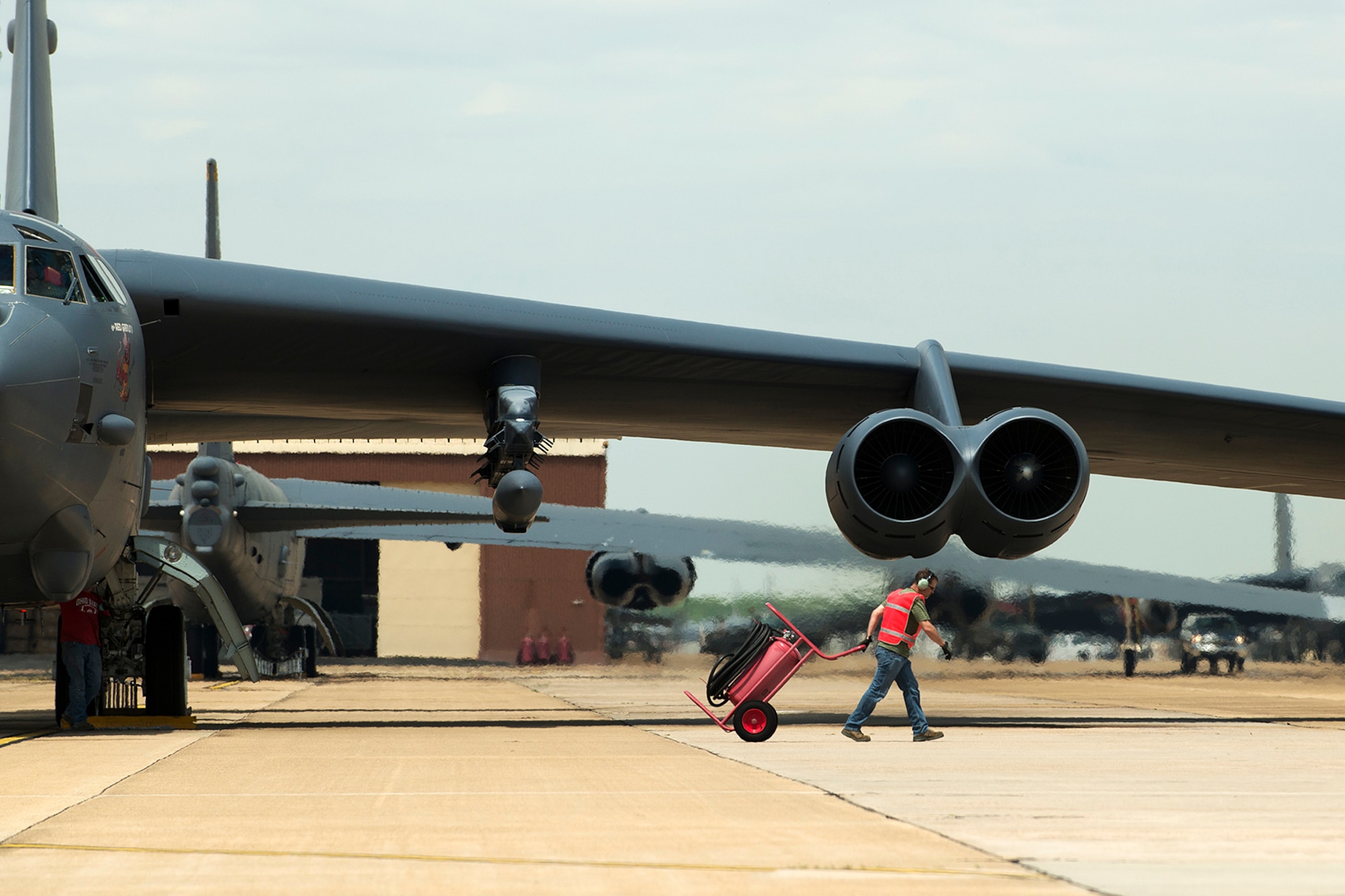 A 307th Aircraft Maintenance Squadron crewchief prepares to launch a B-52H Stratofortress on its first mission carrying the AN/ASQ-236 Radar Pod, April 21, 2014, Barksdale Air Force Base, Louisiana. The 307th Bomb Wing is testing the pod, which will give B-52s the ability to precisely geo-locate points of interest and conduct surveillance activities day or night, in adverse weather conditions. (U.S. Air Force photo by Master Sgt. Greg Steele/Released)
