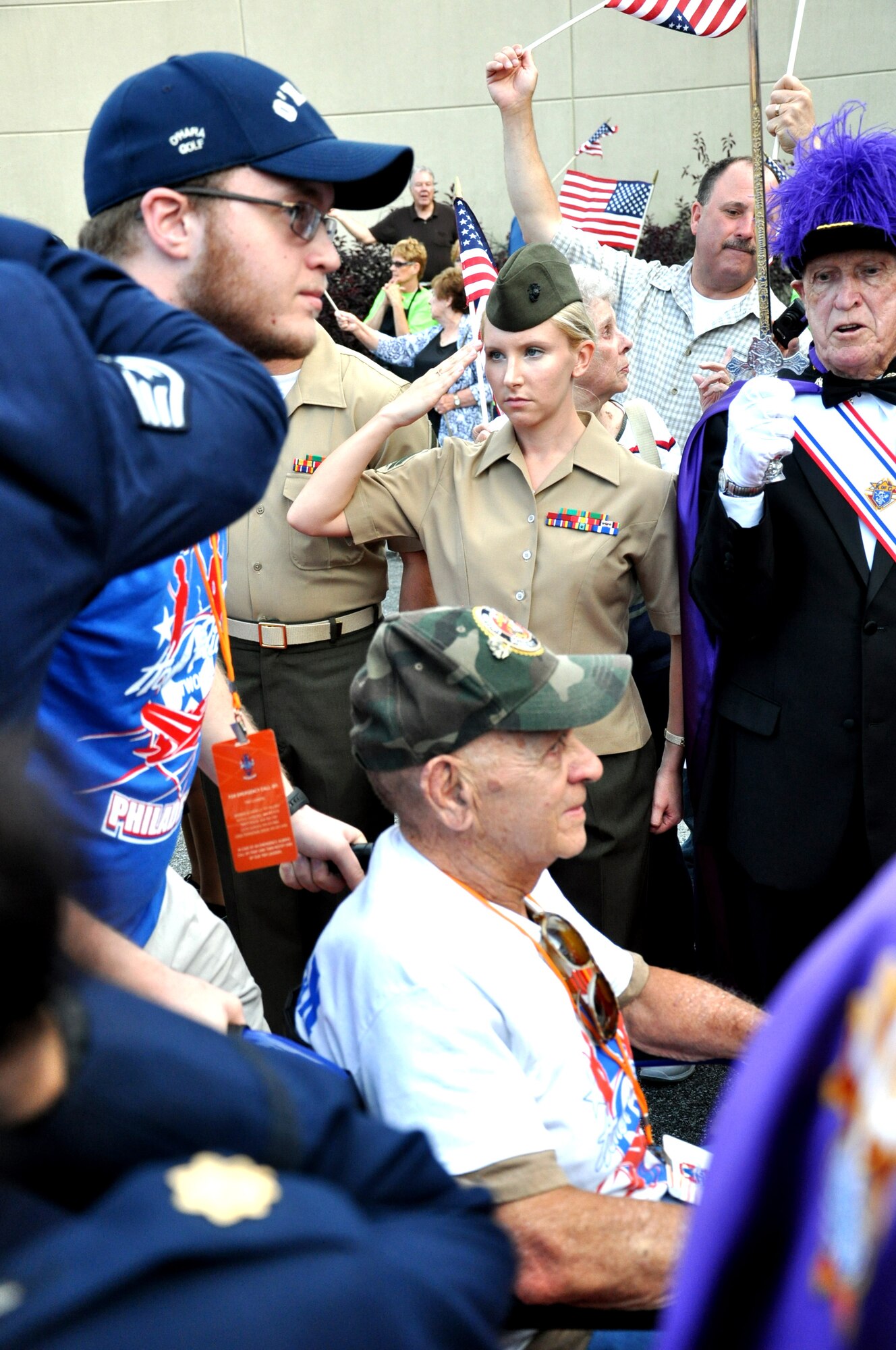 A crowd of more than 700, comprised of families, friends, service members, community members and volunteers, line up along a red carpet as they awaited the arrival of more than 150 World War II and Korean War veterans upon their return from visiting the nation’s capital June 21, 2014, at St. Kevin’s Church in Springfield, Pa.  Service members from Joint Base McGuire-Dix-Lakehurst, N.J., traveled to Pennsylvania to participate in the veterans’ welcome reception. (U.S. Air Force photo by 2nd Lt. Carrie Volpe/Released)