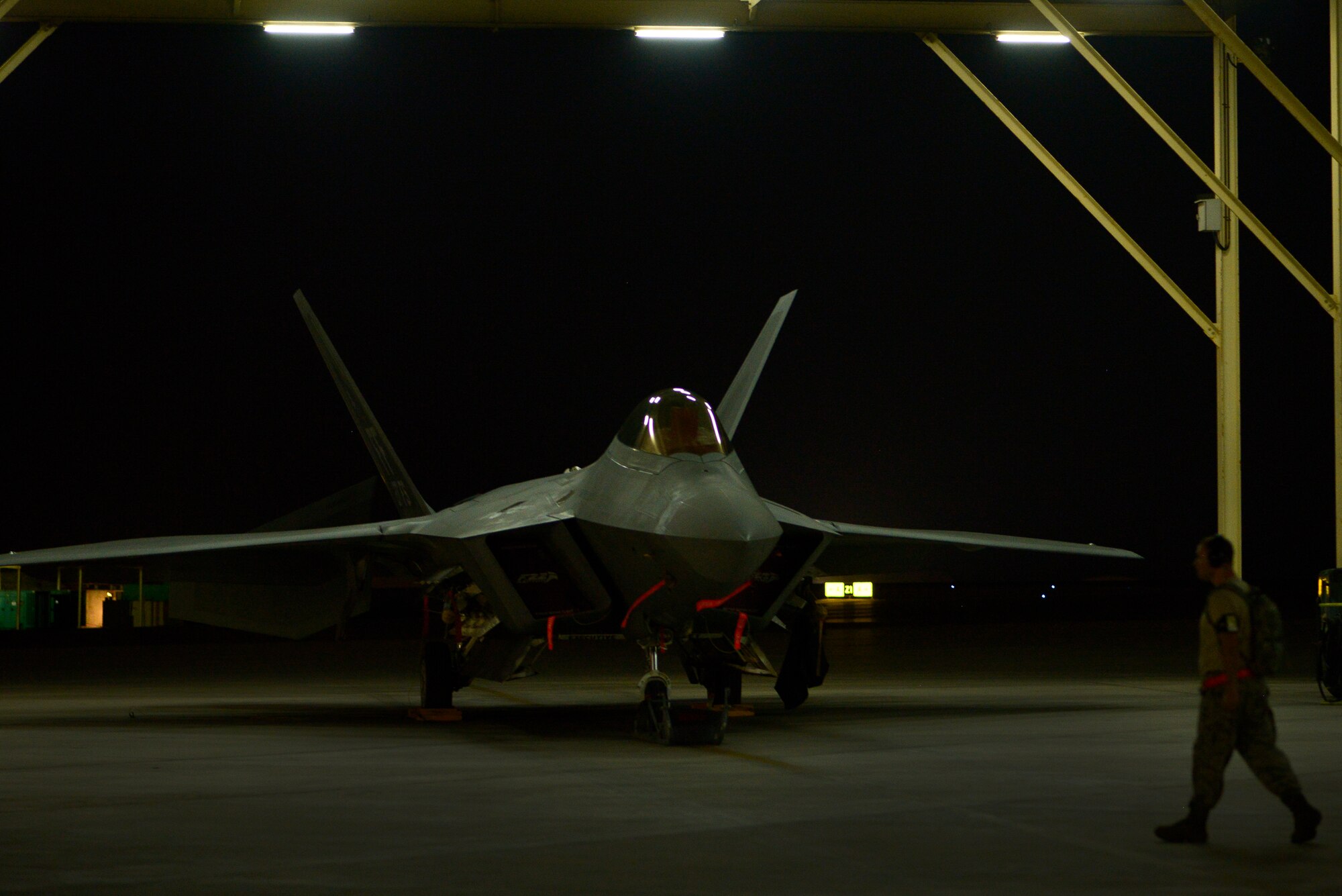 Staff Sgt. Joshua Morgenstern, an avionics systems journeyman deployed from Joint Base Langley-Eustis, Va., returns to the Raptor maintenance area June 17, 2014, at an undisclosed location in Southwest Asia. Raptor maintainers provide combat-ready aircraft in support of Operation Enduring Freedom and Combined Joint Task Force-Horn of Africa.(U.S. Air Force photo by Tech. Sgt. Russ Scalf/Released)