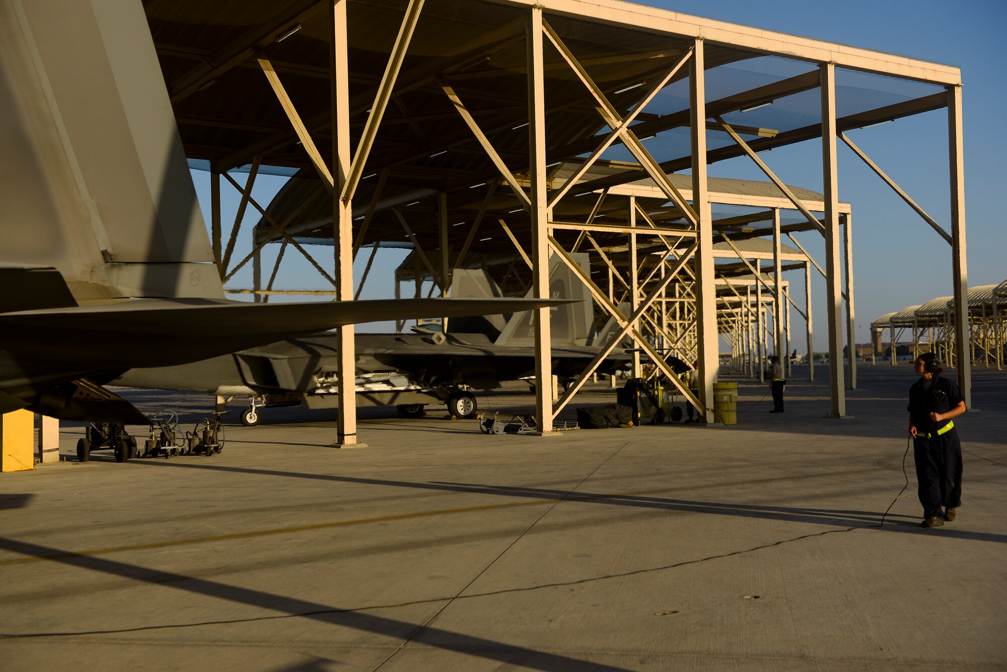 Airman 1st Class Coraima Leal, an assistant dedicated crew chief deployed from Joint Base Langley-Eustis, Va., performs pre-launch operational checks on an F-22A Raptor June 17, 2014, at an undisclosed location in Southwest Asia. The Raptor provides joint commanders with airpower options across the full range of military operations possible in the 21st century. (U.S. Air Force photo by Tech. Sgt. Russ Scalf/Released)