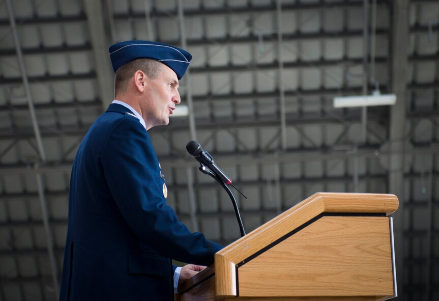 Col. Douglas DeLaMater, 374th Airlift Wing commander, addresses team Yokota and representatives from the Japanese community for the first time during the 374th Airlift Wing change of command ceremony at Yokota Air Base, Japan, June 26, 2014.  (U.S. Air Force photo by Staff Sgt. Chad C. Strohmeyer/Released)