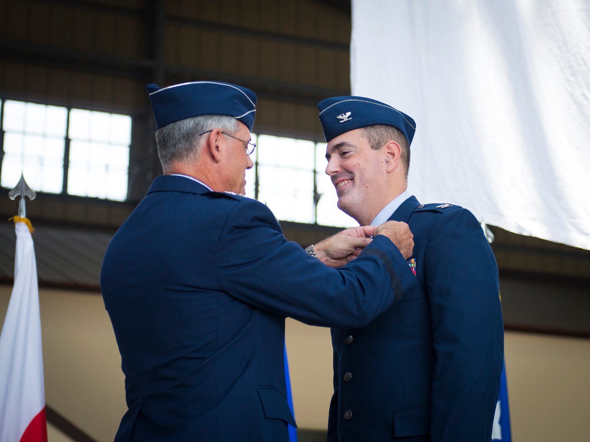 Lt. Gen. Salvatore Angelella, U.S. Forces Japan, and 5th Air Force commander, pins the Legion of Merit on Col. Mark August during the 374th Airlift Wing change of command ceremony at Yokota Air Base, Japan, June 26, 2014. The decoration is the military's sixth highest and was presented to August during the ceremony. (U.S. Air Force photo by Staff Sgt. Chad C. Strohmeyer/Released)