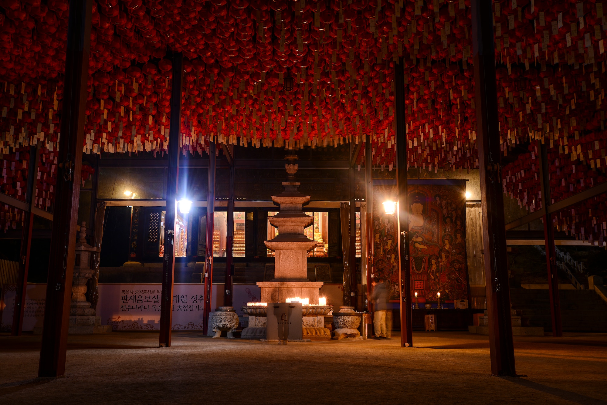 Supplicants light prayer candles at an altar in Bonguensa Temple Feb. 17, 2014, in Seoul, Republic of Korea. During the 20th century Japanese occupation of Korea, the temple became a major Buddhist temple in the region and is now the head temple of Seon Buddhism. (U.S. Air Force photo by Staff Sgt. Jake Barreiro)