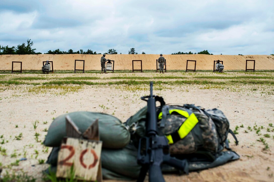 Soldiers check their zero targets on the M16 rifle range during the 2014 Army Reserve Best Warrior Competition on Joint Base McGuire-Dix-Lakehurst, N.J., June 25, 2014.