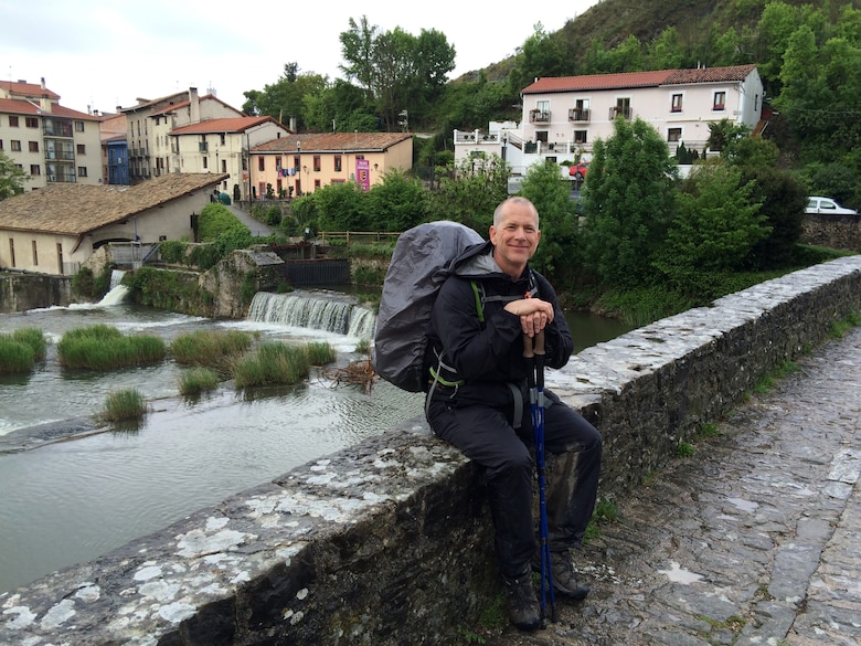 Barney Schulte, a structural engineer in the U.S. Army Corps of Engineers Nashville District, rests on a medieval bridge over the Rio Ulzama in the suburbs of Pamplona, Spain May 3, 2014 during a 490-mile pilgrimage of Camino de Santiago, an ancient path that Christians retrace for spiritual renewal.