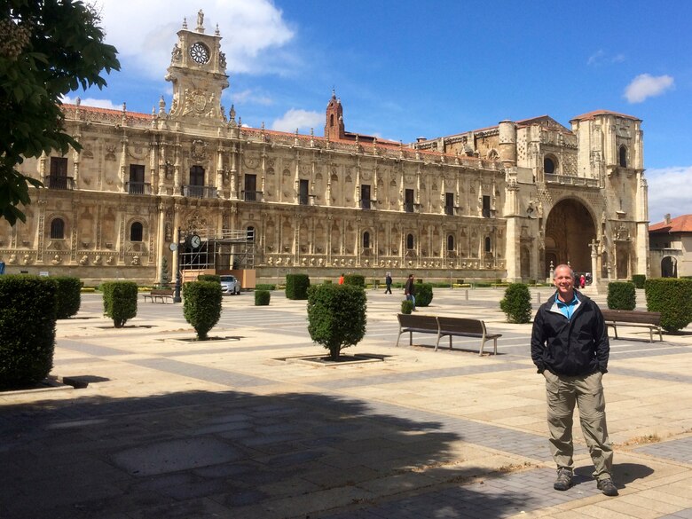 Barney Schulte, a structural engineer in the U.S. Army Corps of Engineers Nashville District, is standing in the Plaza San Marcos May 4, 2014 near an original 12th century pilgrim hostel and monastery located in Leon, Spain.  He visited this landmark during his 490-mile pilgrimage of Camino de Santiago, an ancient path that Christians retrace for spiritual renewal.