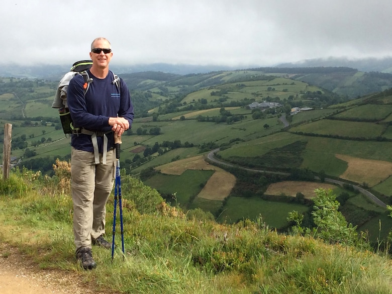 Barney Schulte, a structural engineer in the U.S. Army Corps of Engineers Nashville District, stands on a beautiful vista overlooking the region of Galicia May 30, 2014 in the vicinity of Alto do Poio, Spain.  Schulte said the scenery at this location reminded him of walking on trails in east Tennessee and the Great Smokey Mountains.  He visited this overlook during his 490-mile pilgrimage of Camino de Santiago, an ancient path that Christians retrace for spiritual renewal.