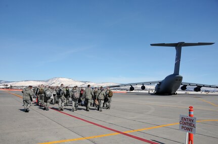 Members of the 173rd Fighter Wing, Oregon Air National Guard, load up on a Tennesse Air National Guard C-5 Galaxy March 2, 2012. The 173rd Fighter Wing was on their way to Hickham Air Force Base, Hawaii, in support of Sentry Aloha, a National Guard Bureau-sponsored exercise that provides an opportunity for dissimilar aircraft combat training with a special focus on air-to-air combat between F-15, F-16 Fighting Falcon and F-22 Raptor aircraft.