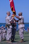 Col. Wolford (left), the new commanding officer, accepts the regimental colors for Combat Logistics Regiment 2, 2nd Marine Logistics Group from Col. Whiteside during a change of command ceremony aboard Camp Lejeune, N.C.,  June 18.  Whiteside commanded CLR-2 for nearly two years.