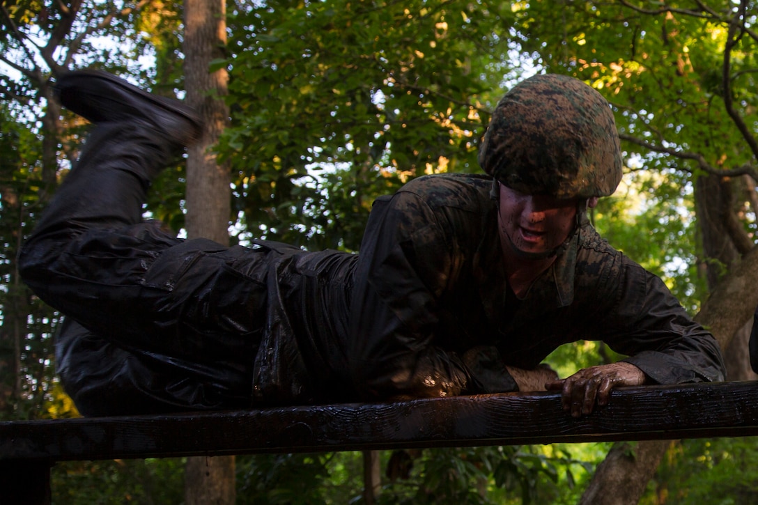 A Marine with 2nd Supply Battalion, Combat Logistics Regiment 25, 2nd Marine Logistics Group vaults over a hurdle during an endurance course aboard Camp Lejeune, N.C., June 26, 2014. Endurance courses give service members an opportunity to test physical fitness while encountering obstacles they might face in combat.