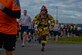 Staff Sgt. Bryan Souder runs beside fellow participants in the Jog for Joe Memorial 5K June 20, 2014, at the base track at Spangdahlem Air Base, Germany. Nearly 500 Airmen and their families participated in the run to commemorate the loss of Staff Sgt. Joseph Hamski, a 52nd CES explosive ordnance disposal flight technician, who was killed in support of Operation Enduring Freedom May 26, 2011. Souder is a firefighter assigned to the 52nd Civil Engineer Squadron. (U.S. Air Force photo/Staff Sgt. Joe W. McFadden)