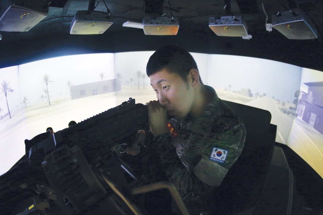 MARINE CORPS BASE HAWAII - A Republic of Korea Marine aims down the sights of a simulated M240B machine gun at the Combat Convoy Simulator, Marine Corps Base Hawaii, June 25, 2014. (U.S. Marine Corps photo by Cpl. Matthew Callahan)