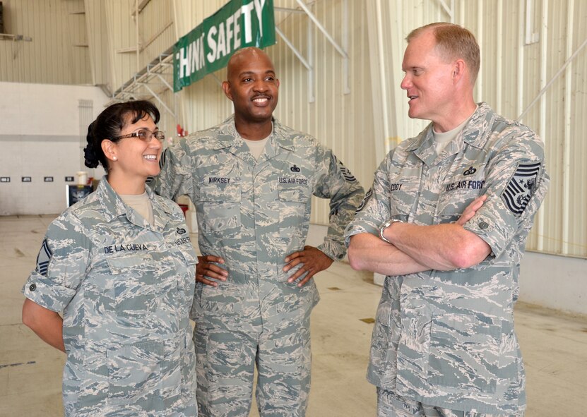 Senior Master Sgt. Teresa De La Cueva, left, speaks with Chief Master Sgt. of the Air Force James A. Cody, right, and Chief Master Sgt. Cameron Kirksey June 25, 2014, during Cody’s visit to Robins Air Force Base, Ga. Kirksey is the Air Force Reserve Command command chief and De La Cueva is with the AFRC commander’s action group. (U.S. Air Force photo/Staff Sgt. Kelly Goonan)