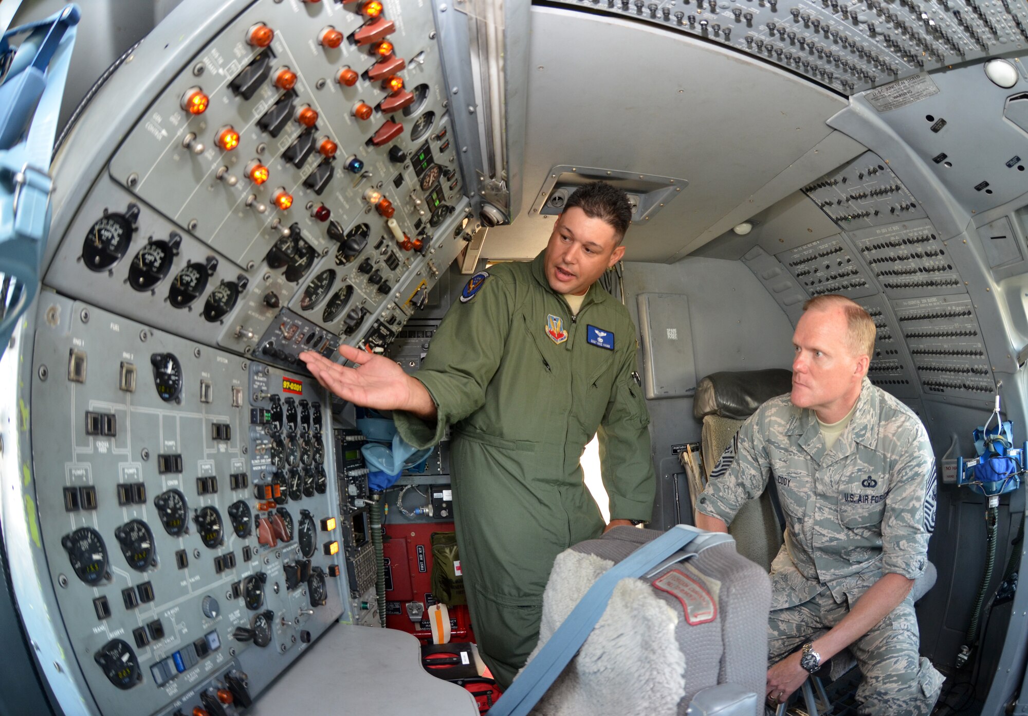 Staff Sgt. Mike Hamm, left, explains to Chief Master Sgt. of the Air Force James A. Cody the role of each knob within the J-Star aircraft June 25, 2014, on Robins Air Force Base, Ga. Cody met with more than 2,000 Airmen while visiting Robins AFB June 24-25. Hamm is with the 116th Air Control Wing. (U.S. Air Force photo/Staff Sgt. Kelly Goonan)